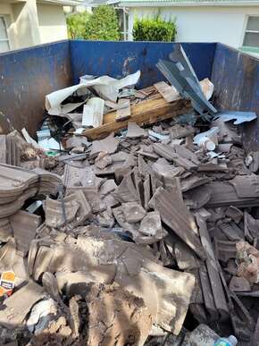 building debris in the dumpster